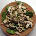 Healthy salad with chunks of canned salmon